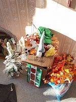 Overall lot showing garlands, Christmas tree, craft kit, gnome, sequin hat, straw bundle and small decorations