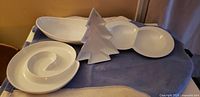 All four white ceramic serving dishes displayed