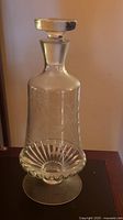 Full view of crystal decanter with stopper attached