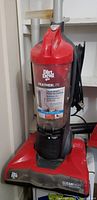 Front view of Dirt Devil Featherlite CleanPath upright vacuum showing body and dust canister