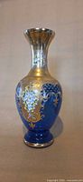 Full view of cobalt blue Murano vase showing flared neck and foot