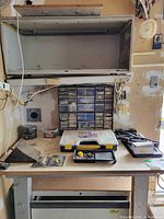 Workbench with multi-drawer parts cabinet, organizer case, trays and hardware