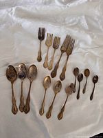 All 15 International Silver flatware pieces displayed