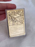 Card in plastic case held by hand