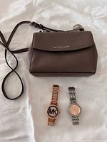 Group shot of purse and both watches