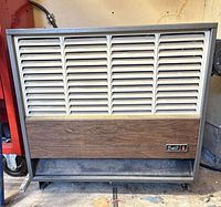 Front view of Wait heater showing louvered grille and wood panel