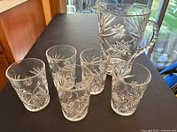Pitcher and five tumblers showing Prescut pattern and clarity