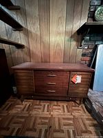Front view of Lane cedar hope chest showing louvered facade, brass hardware, tapered legs