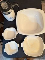 Coffee pot, extra-large casserole, medium casserole, two mini casseroles visible