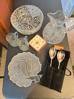 Overview of all items: bowl, pitcher, two mugs, coasters box, tree platter, serving spoons in sleeve