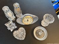 All crystal pieces grouped together on black surface