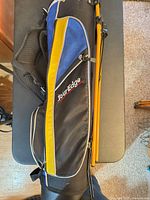 Side view of Tour Edge junior stand bag with yellow panel