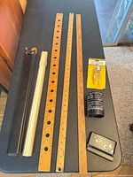Overview of yardsticks, folding rule, compass package, converter pencil holder, magnifier