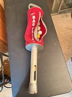 Full view of Bag Shag retriever showing tube and open pouch with golf balls