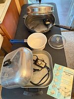 All three cookware pieces with accessories visible