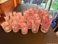 Front view of all twenty Memory Lane pink glasses in three sizes