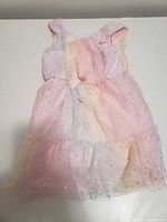 Full view of pastel glitter-dot tulle dress