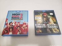 Front view of both Disney Blu-ray cases