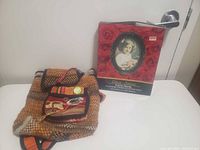 Overall view of framed box and woven bag