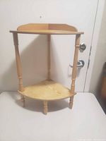 Full view of two-tier wooden corner shelf