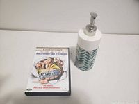 DVD and soap dispenser side by side