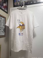 Full front view of white T-shirt with Vikings graphic