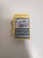 Stack of Pokémon cards with Hisuian Samurott on top