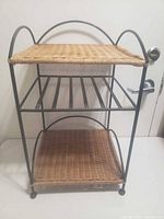 Front view of metal and wicker shelf