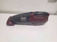 Left side view of Shark cordless 15.6-volt handheld vacuum