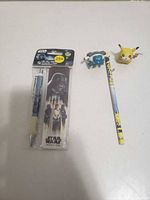 Star Wars Rogue One pen package, Pokemon pencil, Pikachu and Blastoise toppers overview