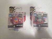 Front view of both sealed Yu-Gi-Oh! figures in blister packs