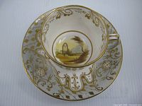 teacup nested in saucer, showing gilt decoration