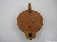 Top view showing portrait medallion and fill hole