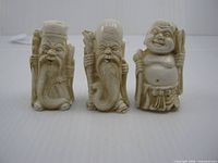 Front view of three Chinese resin Lucky Immortals figurines