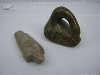 Both soapstone carvings side by side