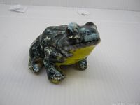 Front perspective of clay frog figurine