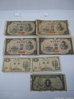 All seven notes laid out front side visible