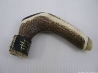 Side view of antler cane handle showing overall shape and coloration