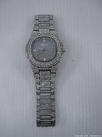 Front view of full watch showing bracelet and crystal detailing