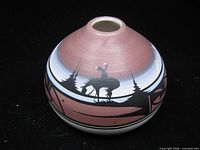 front view of painted ceramic vase showing deer scene