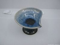 Top view showing blue crystalline glazed interior and asymmetric rim