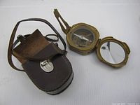Compass and leather case overall view