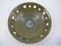 Top view showing pierced rim and interior glaze
