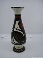 Front view of cream, brown and black hand painted bud vase