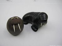 Both walrus figures side by side