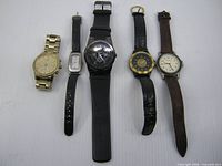 Group shot of five wristwatches lined up