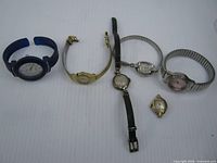 Group view of six watches in lot