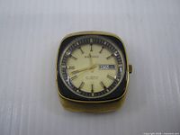 Front view showing dial, brand, day-date window