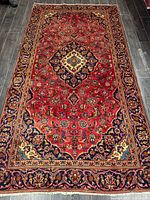 Full view of entire Kashan rug showing design and borders