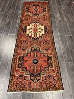 Full view of rug showing entire pattern across grey flooring